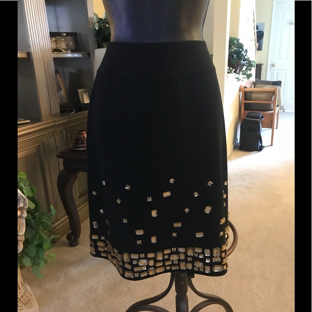 Nearly new black skirt with gold stones